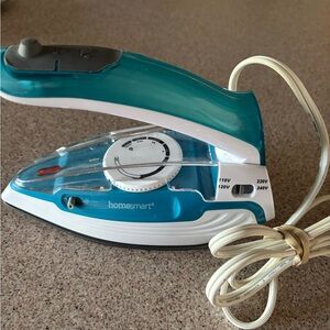 Teal and White,Craft or Travel Iron with Steam Boost.Handle folds up. Light